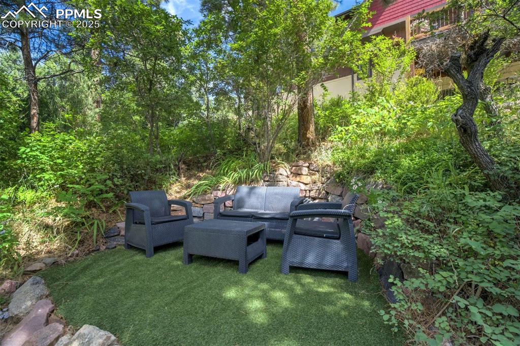 Image 44 of 50: View of yard with outdoor lounge area