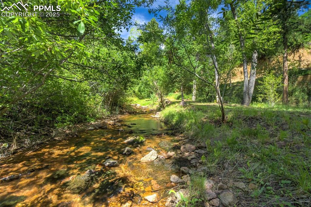 Image 45 of 50: View of the creek below the home