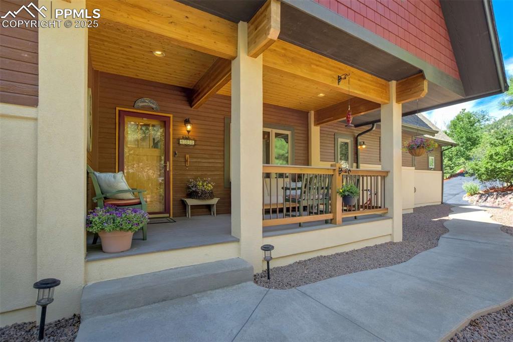 Image 7 of 50: Property entrance featuring a covered front porch