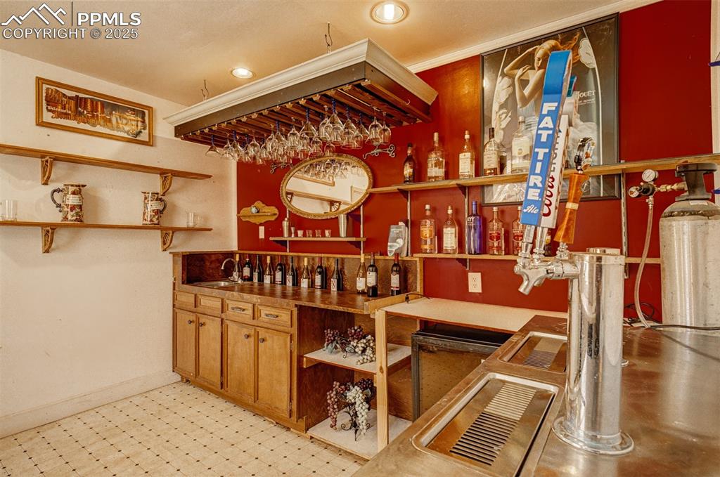 Image 18 of 45: Secret Garden: Bar Hut - sink, shelving, wine fridge