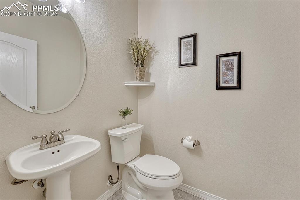 Image 20 of 50: Main level powder bathroom