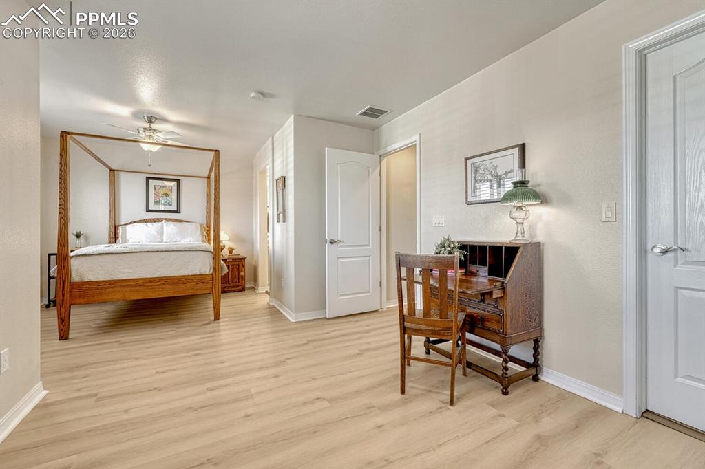 Image 23 of 50: Primary bedroom with sitting area