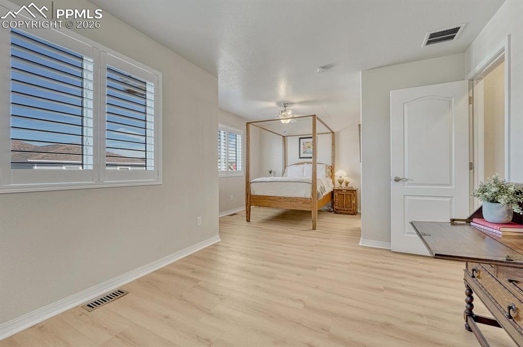 Image 24 of 50: Primary bedroom with sitting area