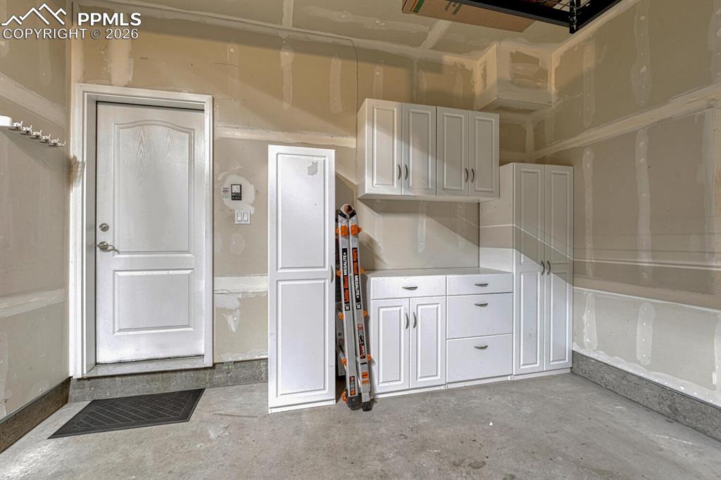 Image 35 of 50: Garage with extra storage space!