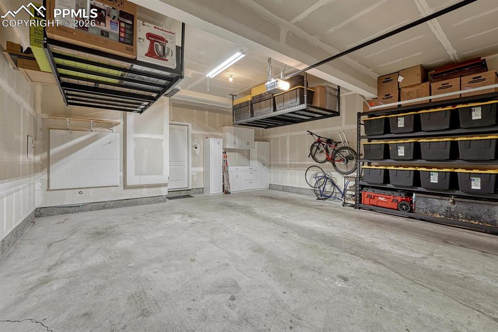 Image 36 of 50: Garage with extra storage space!