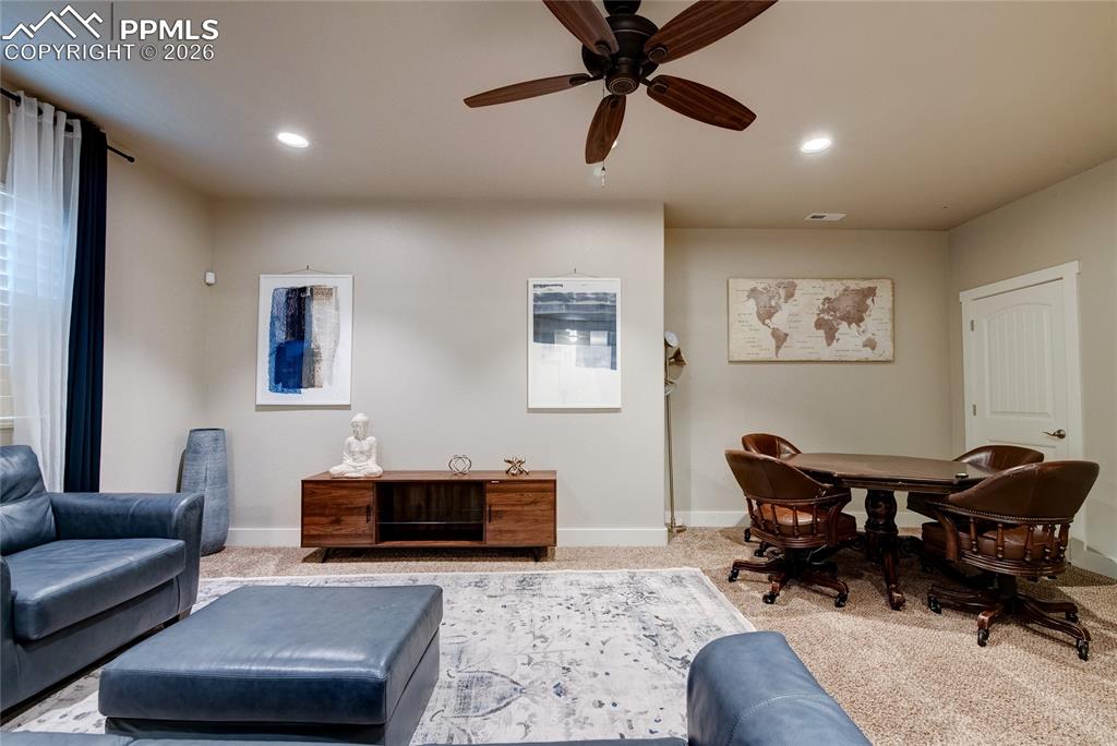 Image 31 of 44: Living room featuring carpet flooring, a ceiling fan, and recessed lighting