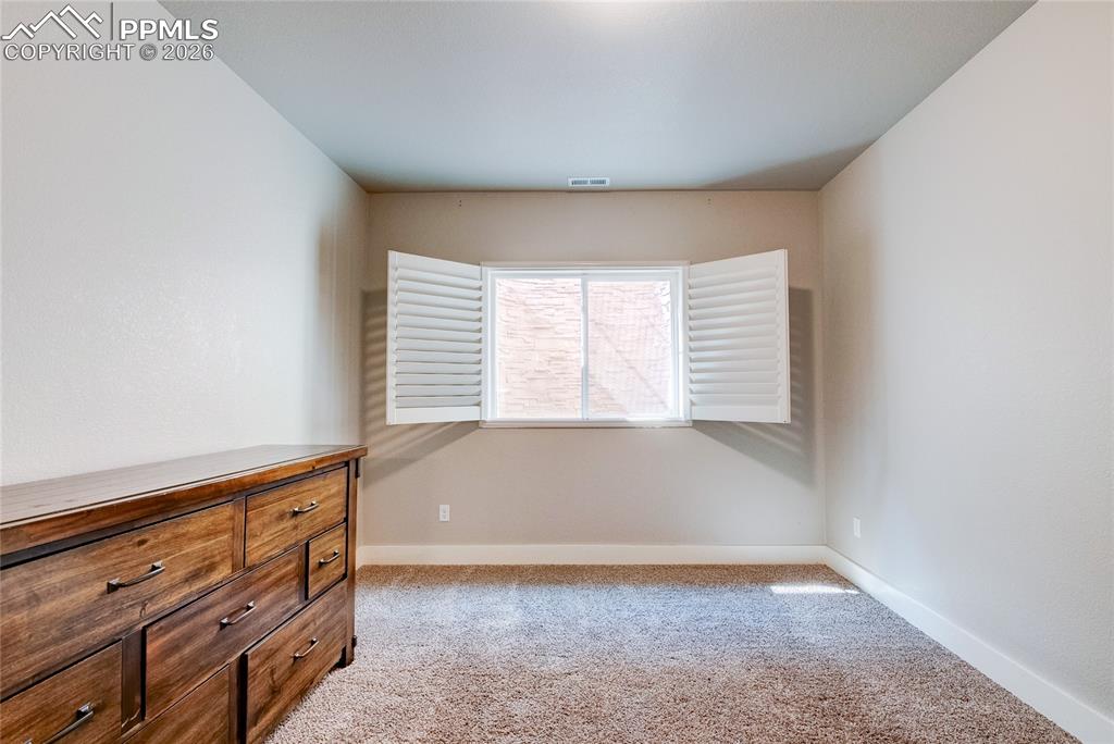Image 35 of 44: Unfurnished bedroom featuring light colored carpet and baseboards