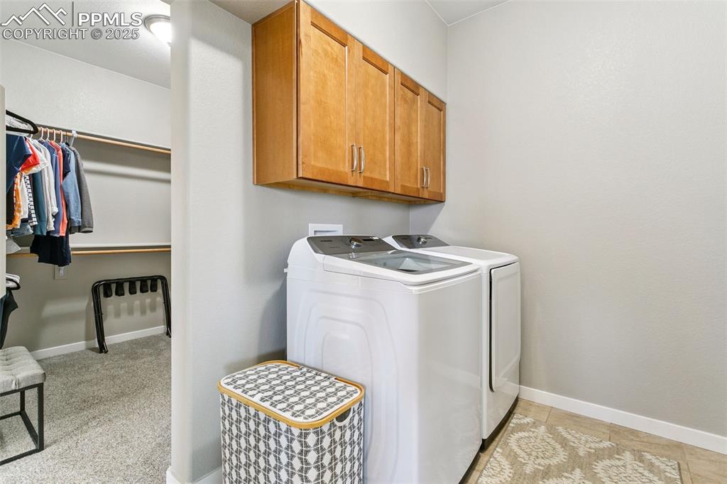 Image 29 of 50: Adjoining Laundry to Primary Walk-in Closet
