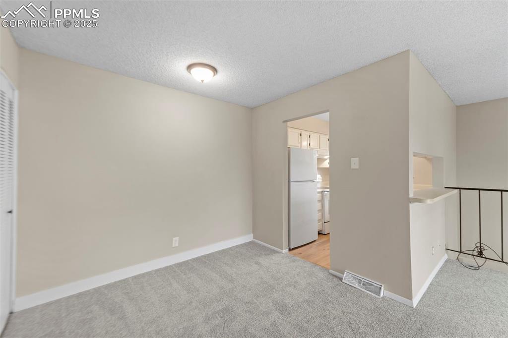 Image 11 of 18: and entrance into kitchen