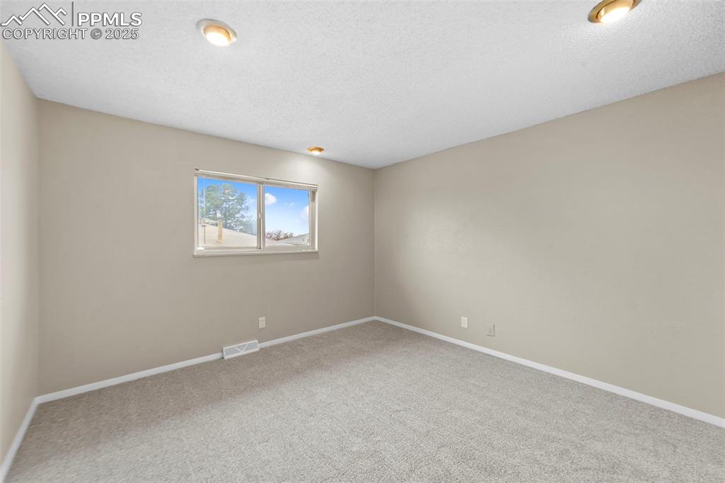 Image 14 of 18: Master Bedroom