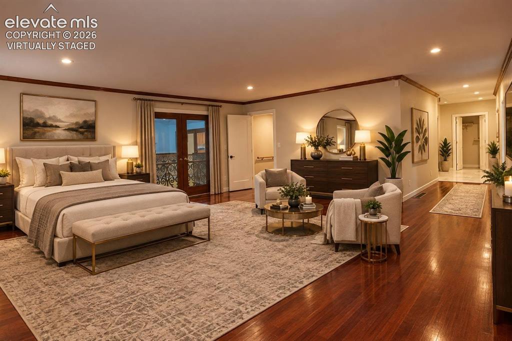 Image 17 of 50: Spacious room featuring wood-finish flooring, recessed lighting, crown mold