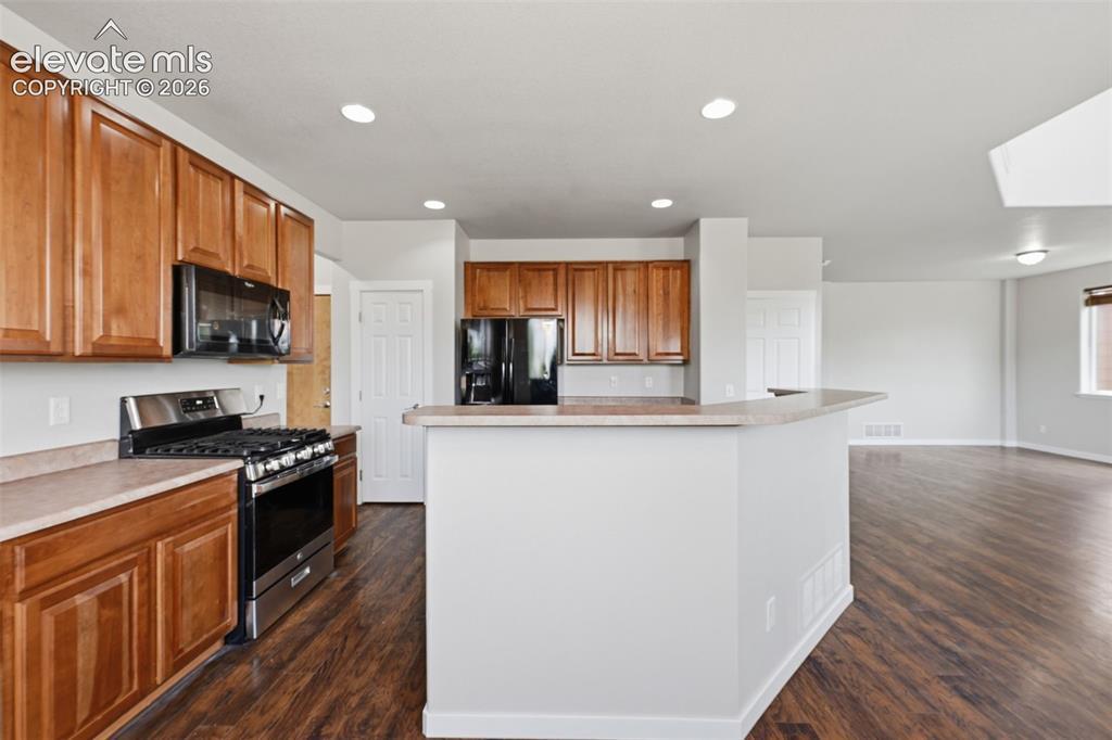Image 11 of 32: Kitchen with New Gas Range/Oven and Center Island