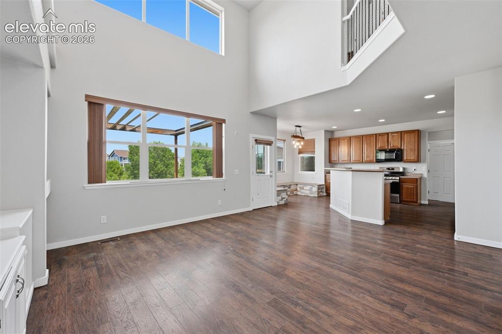 Image 5 of 32: Main Level Family Room/Kitchen/Dining