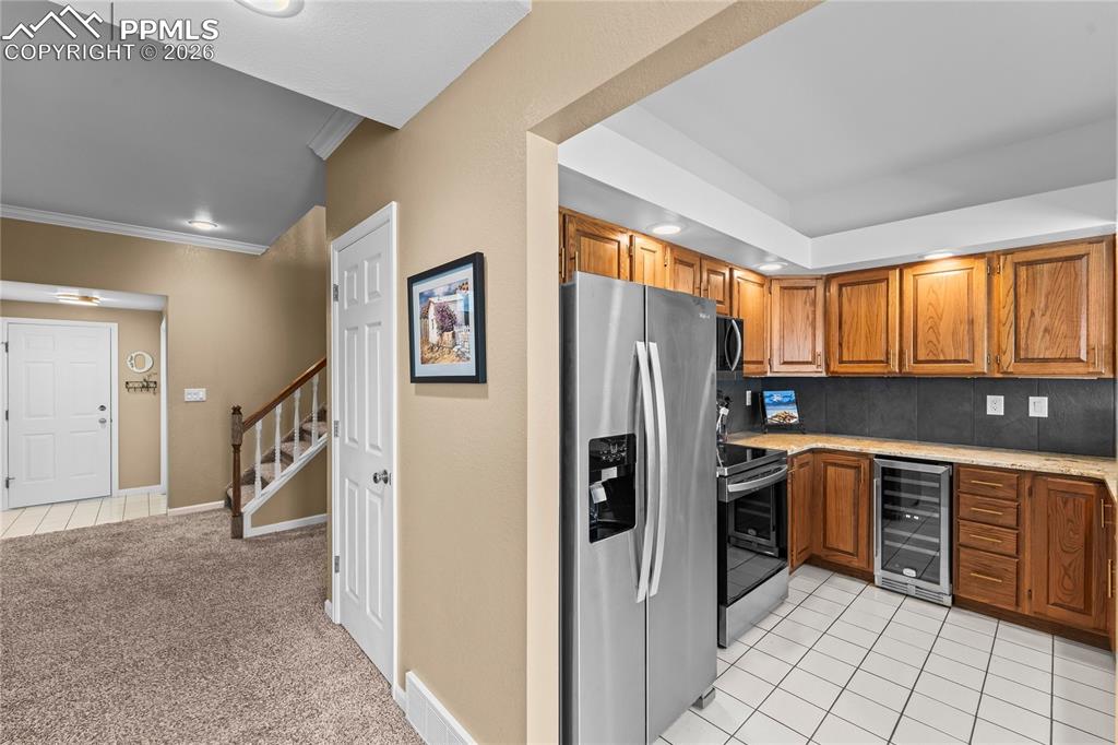 Image 10 of 48: New stainless appliances including a new wine frig, plus new granite counte