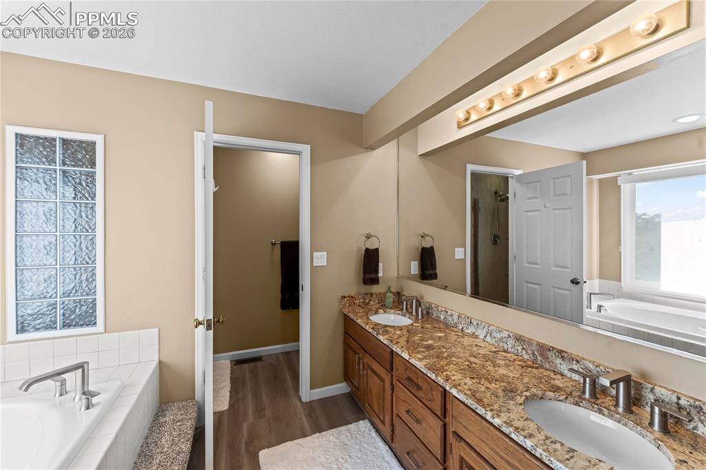 Image 23 of 48: Beautiful updated five piece primary bath