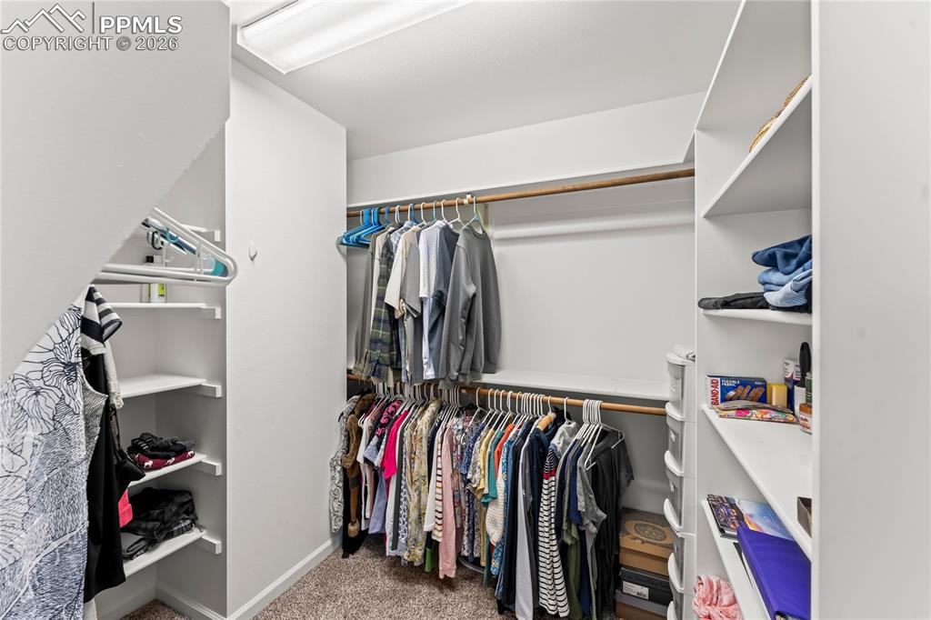 Image 26 of 48: Large walk-in closet in the primary bedroom