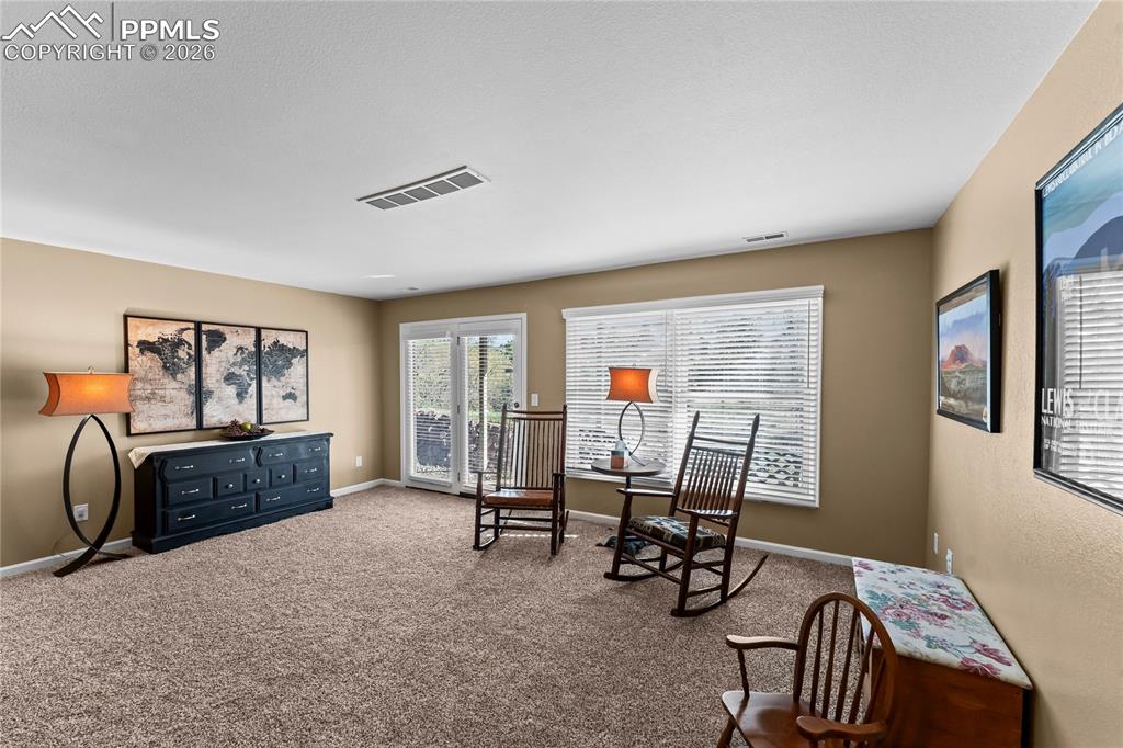 Image 34 of 48: The family room features a nice walk-out to the beautiful patio.