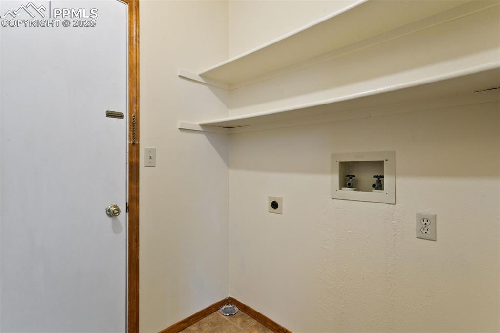 Image 14 of 24: Laundry room with hookup for an electric dryer and hookup for a washing mac