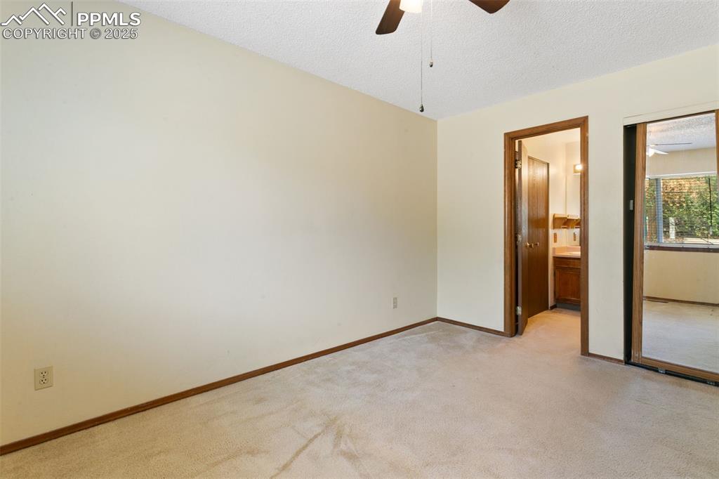 Image 16 of 24: Spare room featuring light colored carpet, a textured ceiling, and a ceilin