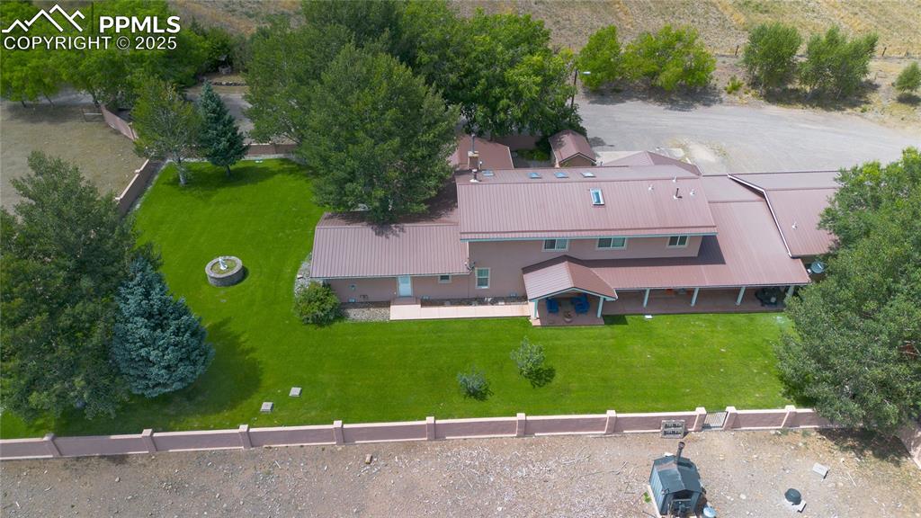 Image 8 of 50: Aerial view of property and surrounding area