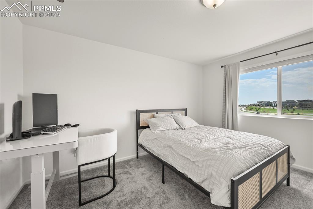 Image 22 of 28: Bedroom with carpet and baseboards