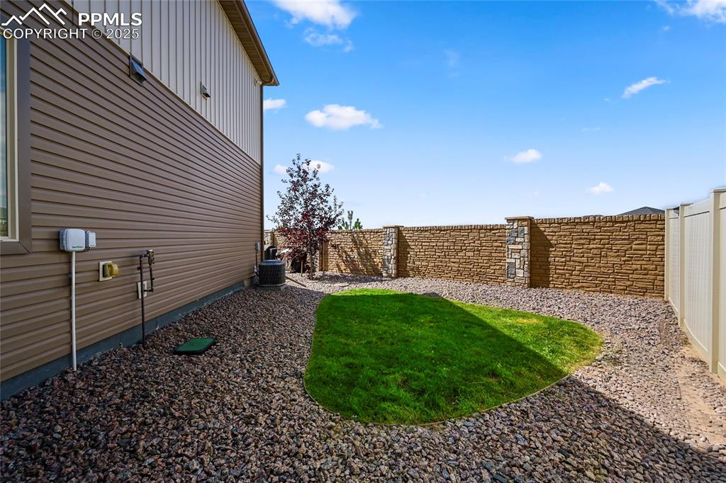 Image 27 of 28: View of fenced backyard