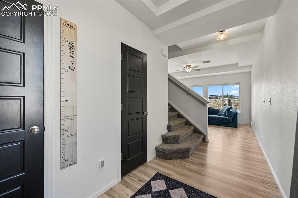 Image 4 of 28: Foyer entrance featuring light wood-style flooring and stairway