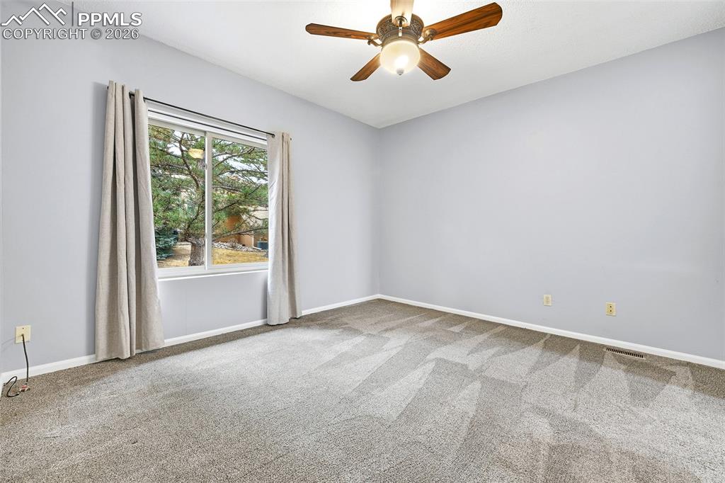 Image 18 of 30: The second en-suite bedroom with ...