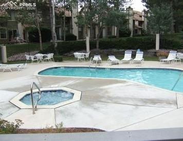 Image 29 of 30: ...outdoor pool, spa, & fully equipped gym perfect for year-round fitness,