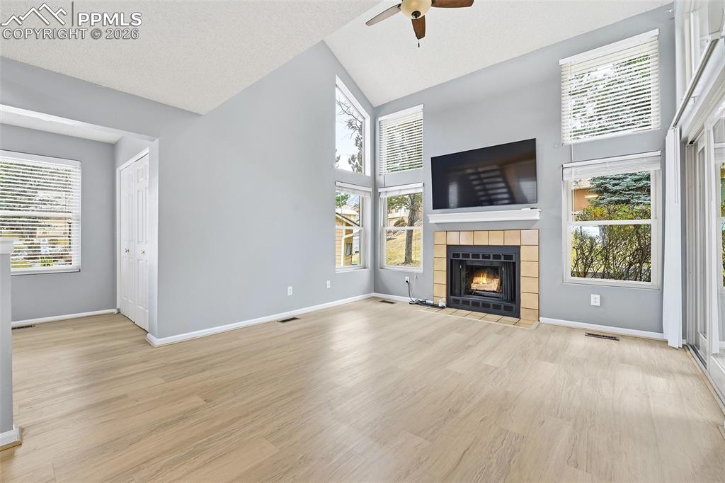 Image 4 of 30: A covered entry welcomes you inside, where LVP flooring and an abundance of