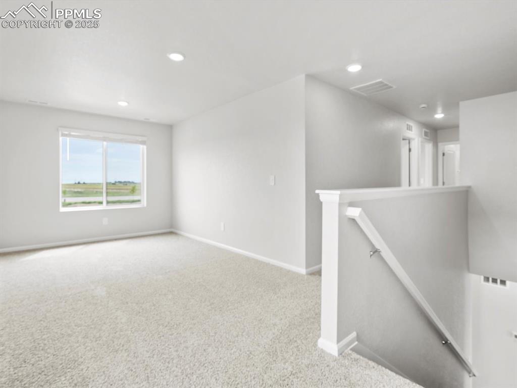 Image 15 of 28: Carpeted spare room featuring recessed lighting