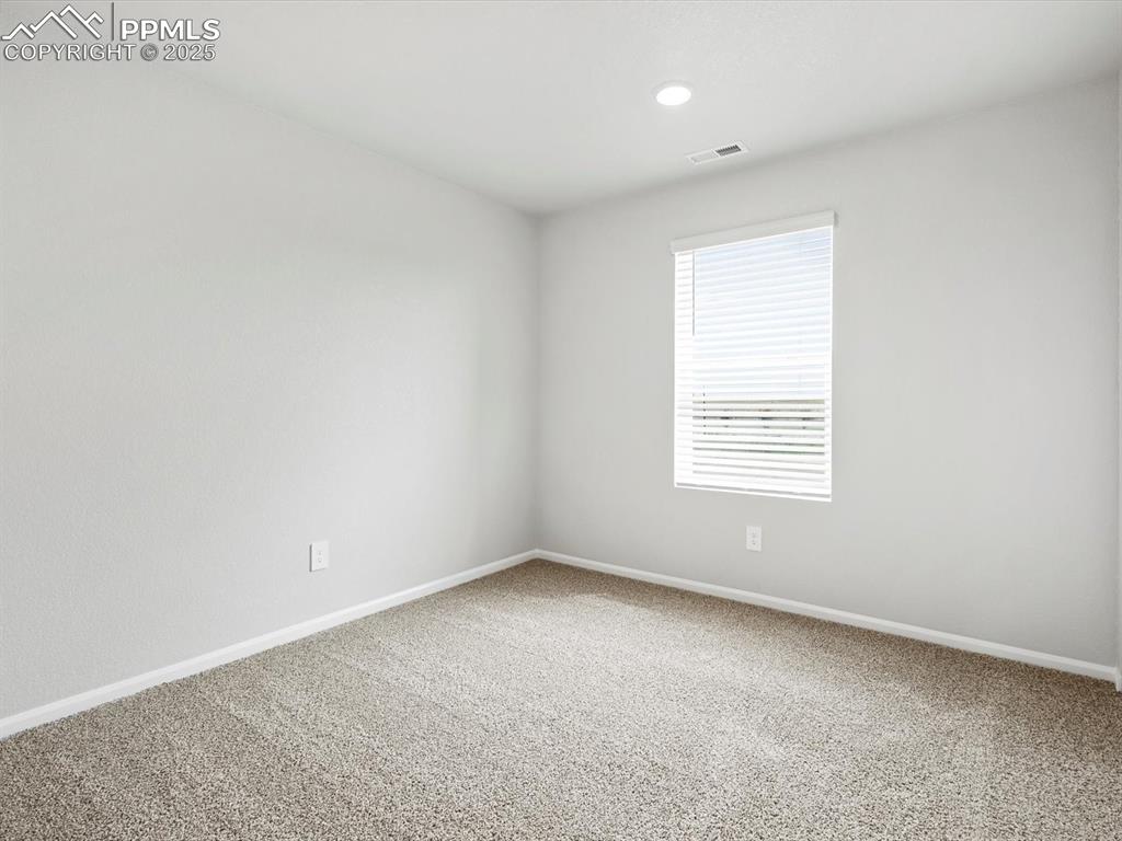 Image 16 of 28: Carpeted empty room featuring baseboards and recessed lighting
