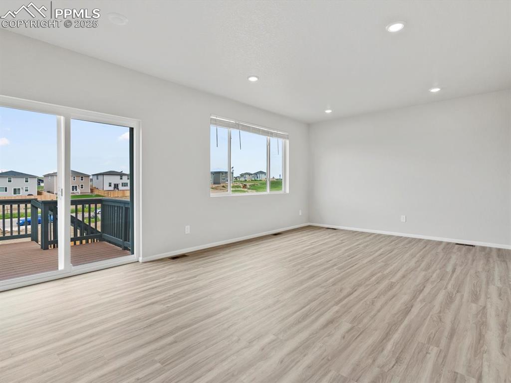 Image 7 of 28: Unfurnished room featuring light wood-style floors, recessed lighting, and