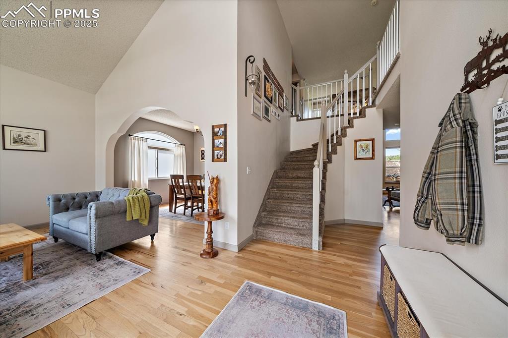Image 5 of 47: Foyer entrance with plenty of natural light, arched walkways, a high ceilin
