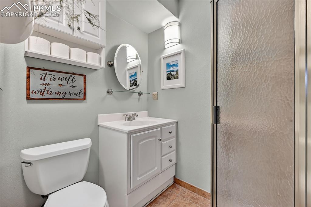 Image 28 of 50: Adjoining bathroom to Master