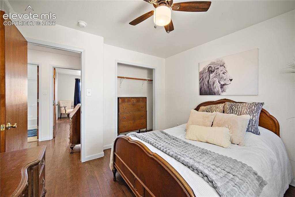Image 16 of 29: Bedroom featuring wood-finish flooring, a ceiling fan with integrated light