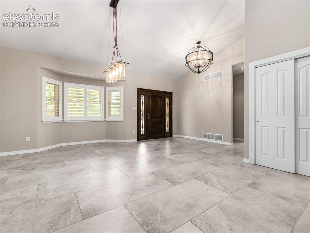 Image 4 of 41: Entry and Dining Room