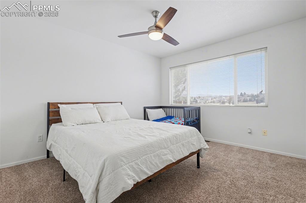 Image 13 of 35: Primary Bedroom backs to Golf Course & Has Views!