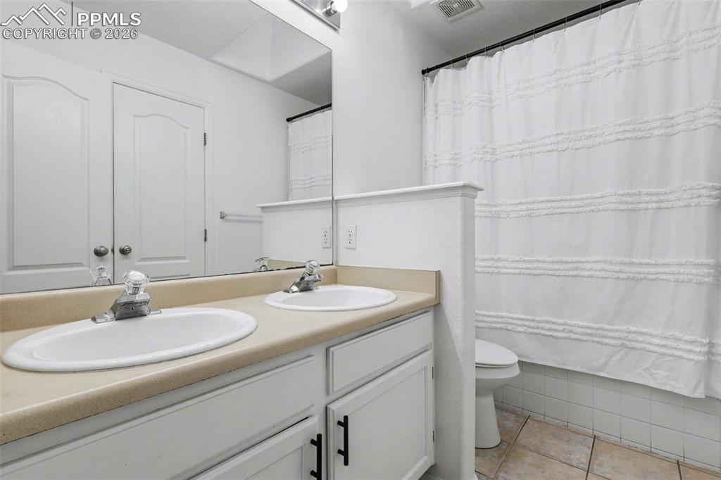 Image 16 of 35: Main Level Full Bath w/Double Vanity