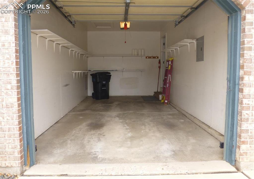 Image 4 of 35: Long Garage w/Shelving