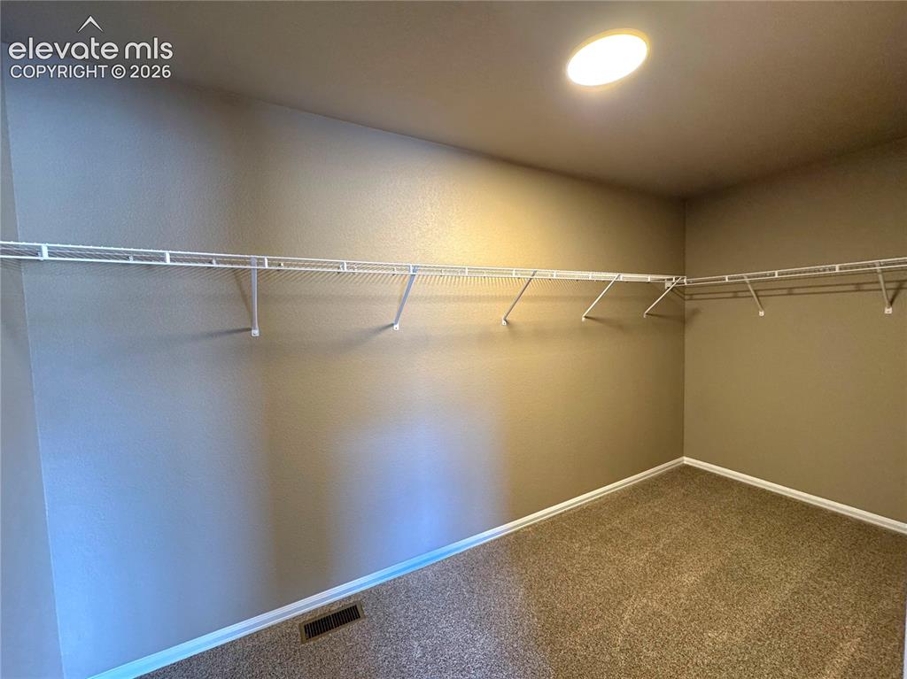 Image 18 of 26: Master Walk in closet