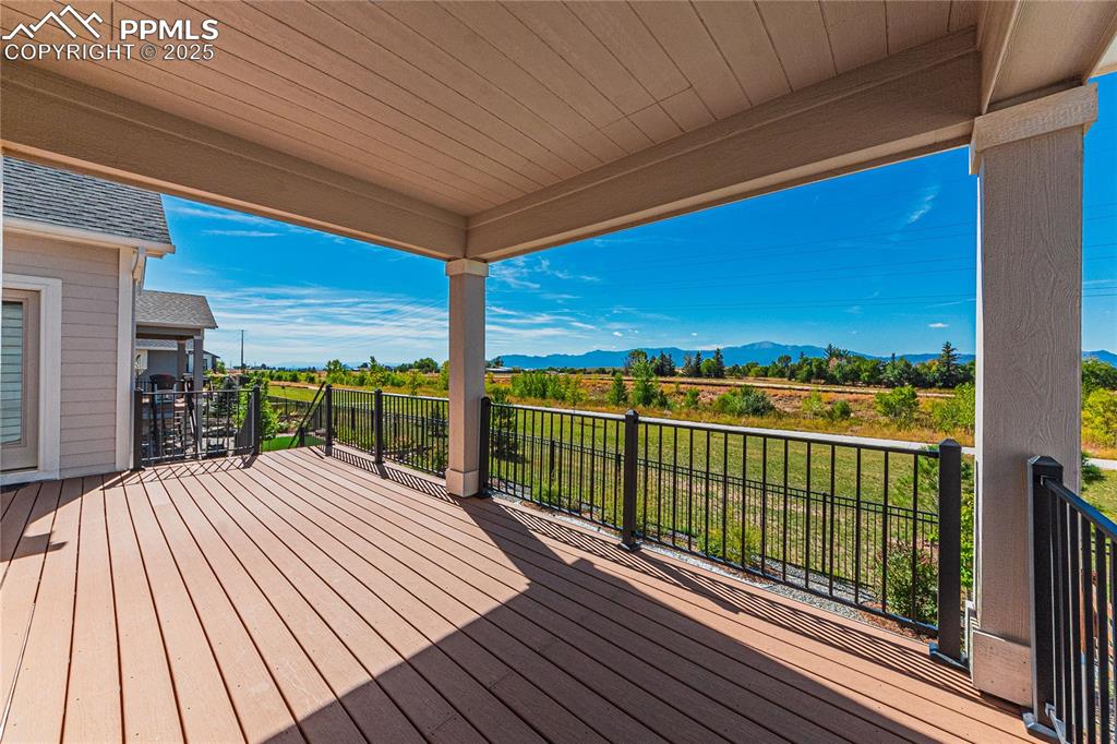 Image 37 of 49: Deck featuring a mountain view
