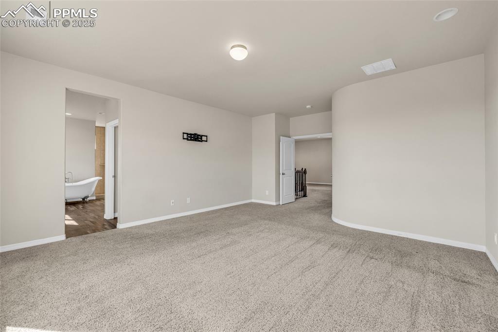 Image 21 of 44: Empty room featuring carpet