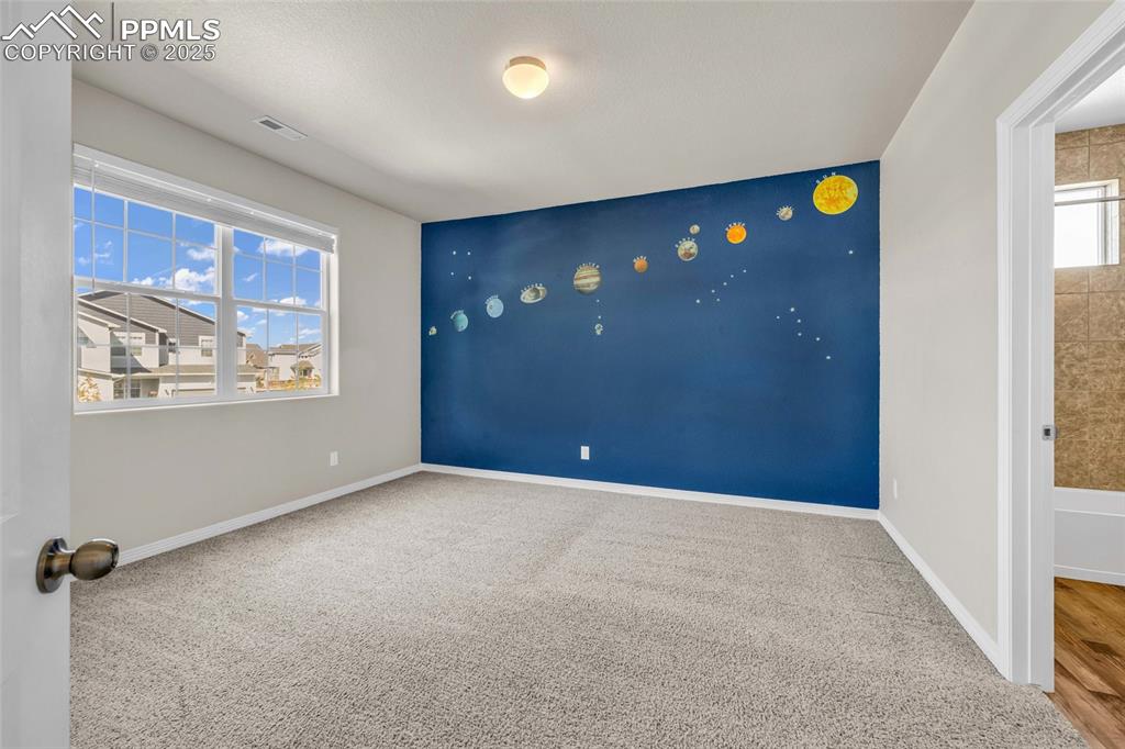 Image 30 of 44: Carpeted spare room with baseboards