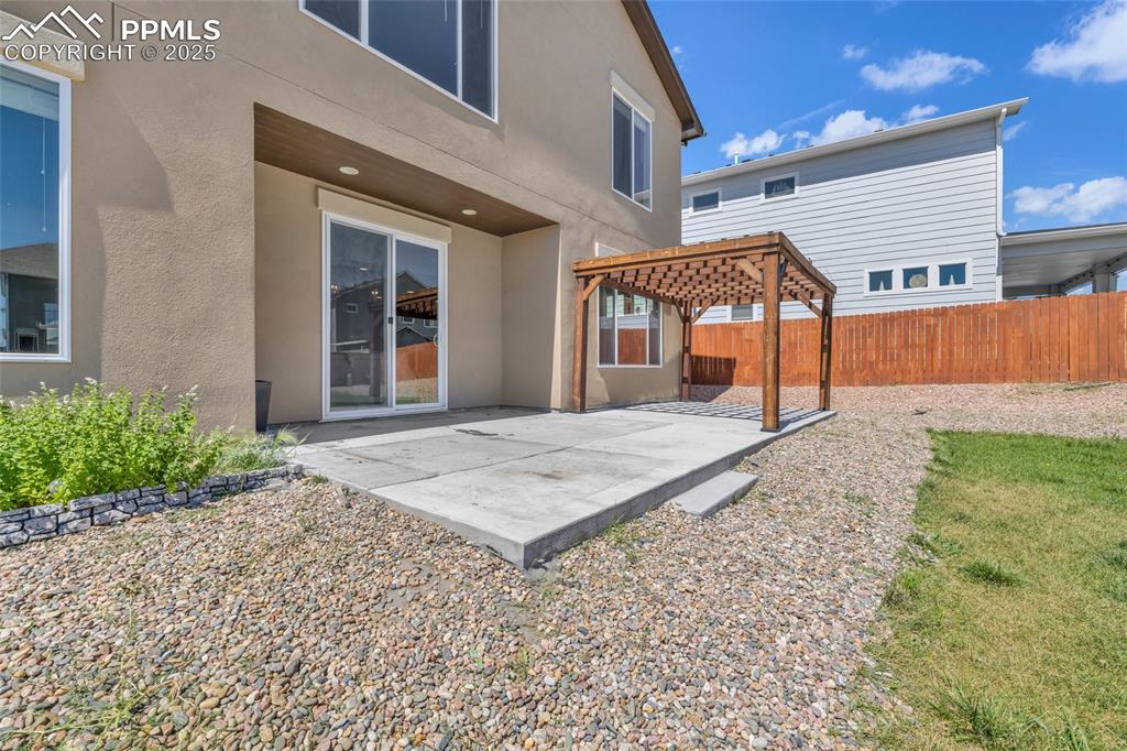 Image 41 of 44: Back of house featuring stucco siding, a patio area, and a pergola