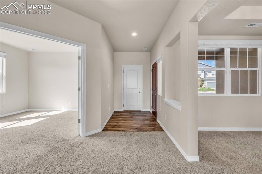 Image 5 of 44: Hall featuring carpet, plenty of natural light, and recessed lighting
