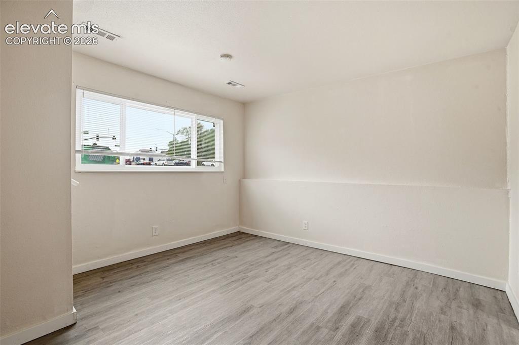 Image 6 of 31: Vinyl Plank Floors and Fresh Paint in the Living Room