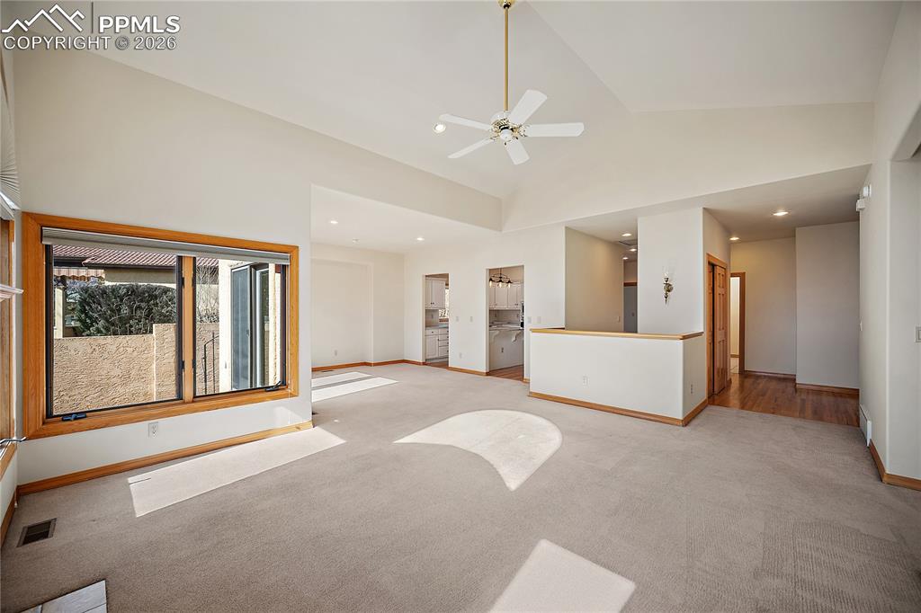 Image 13 of 44: Open Living Room to Dining Room