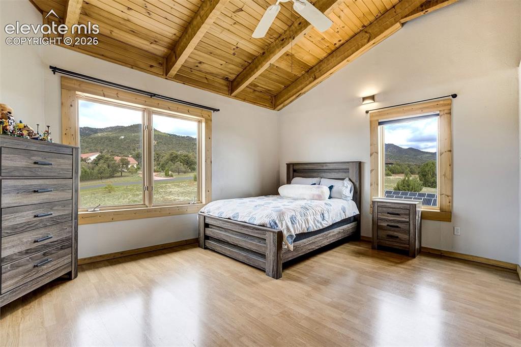 Image 23 of 50: Room featuring a vaulted wood-finish ceiling with exposed beams, wood-finis