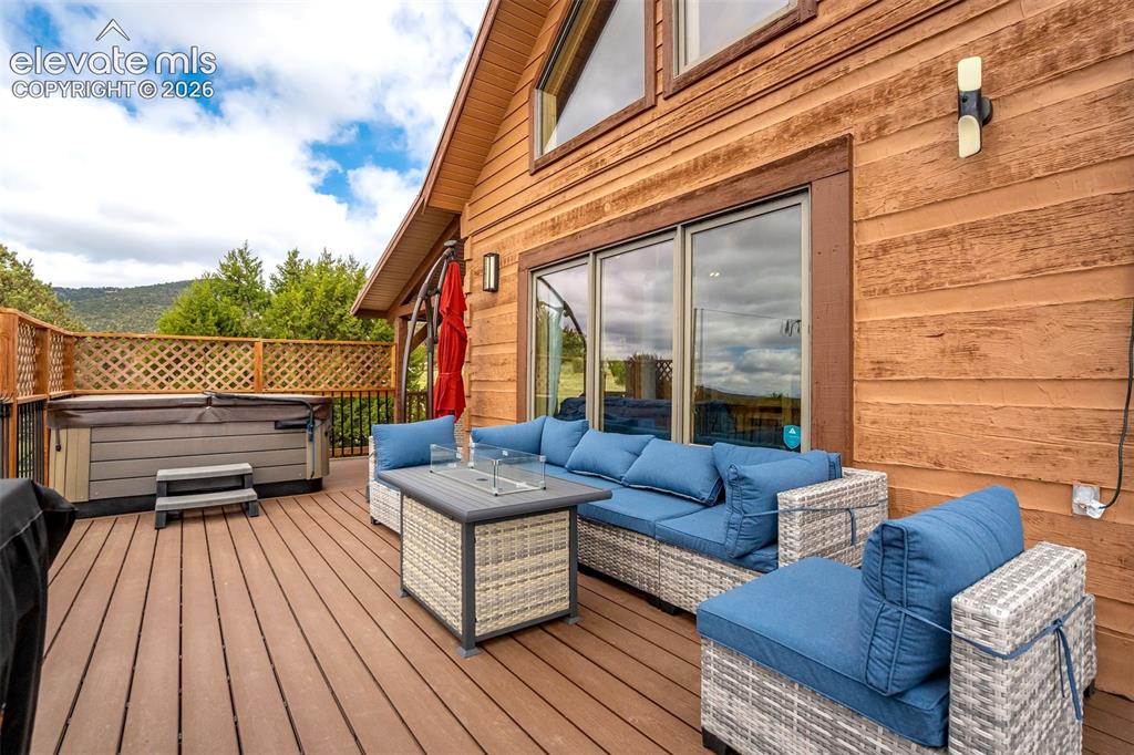 Image 46 of 50: Spacious outdoor deck featuring wood-finish flooring